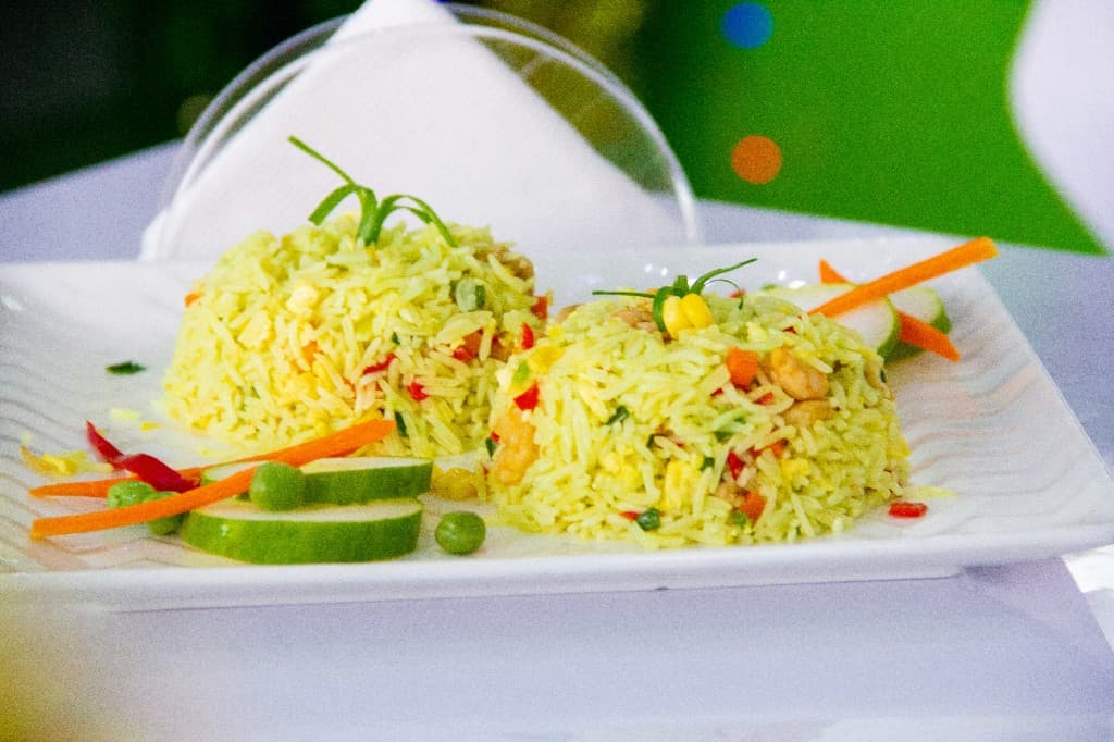 Food spread - rice, plantains, community meal